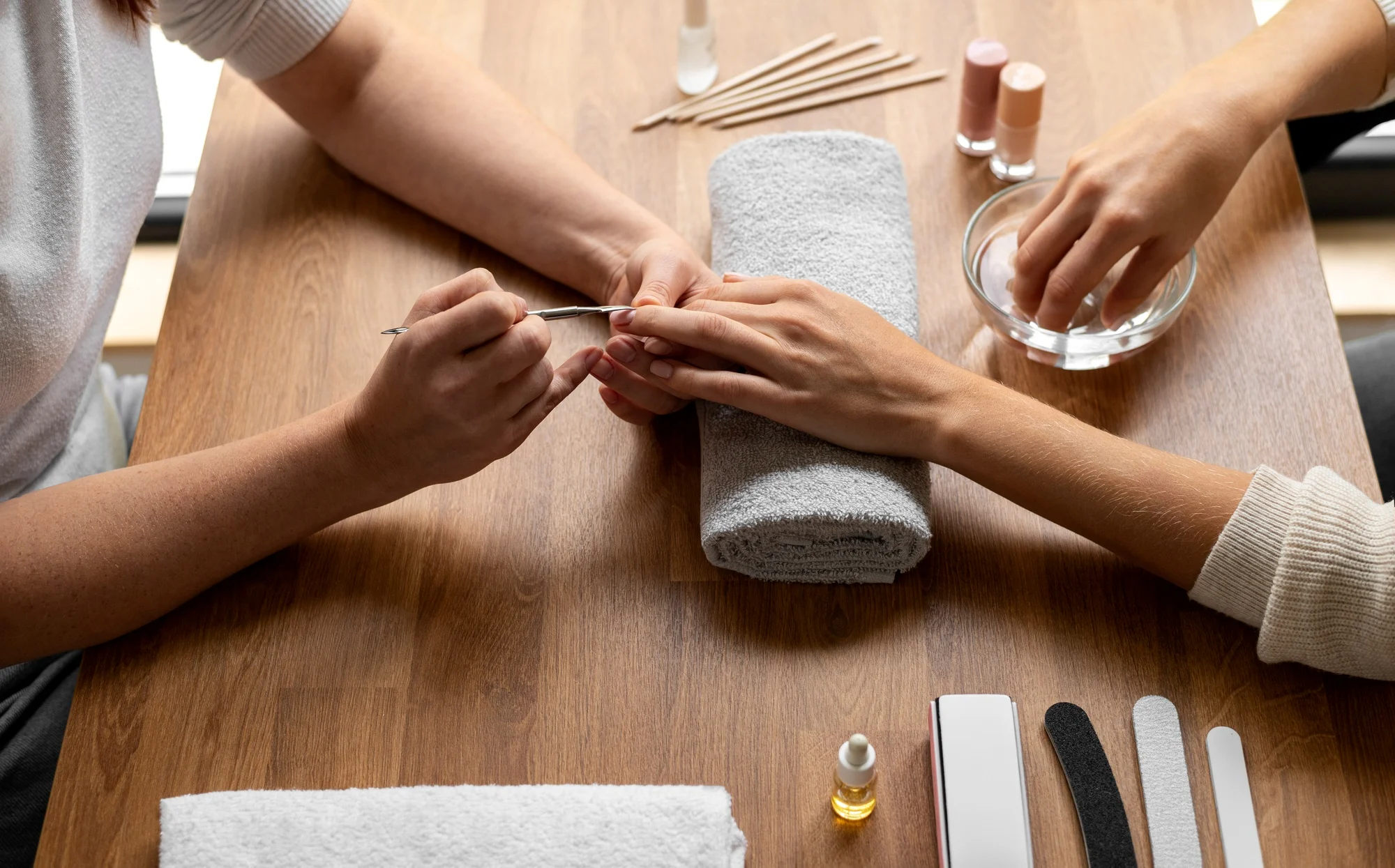 Nails artist working with a customer