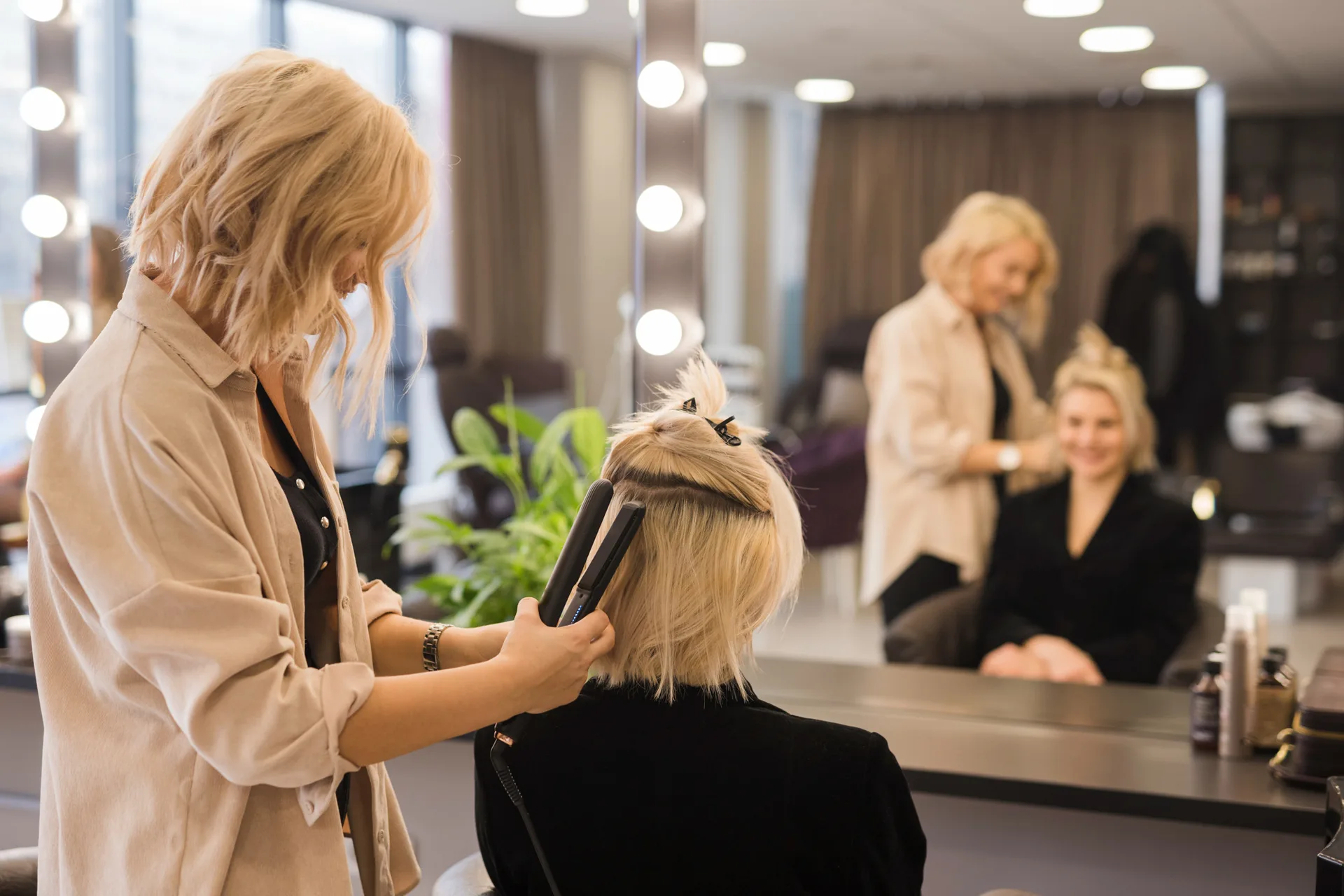 Hair stylist working with a customer