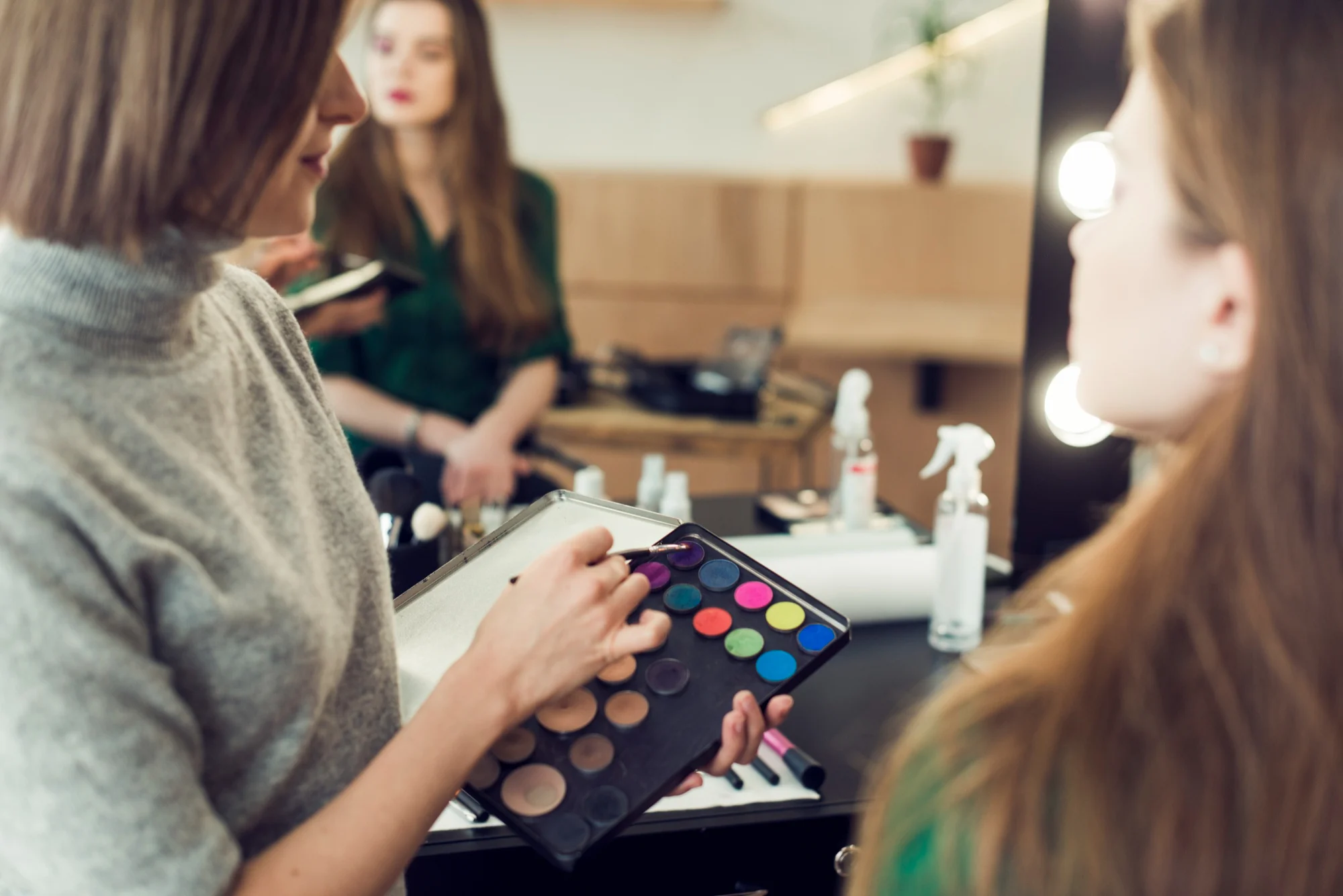 Makeup professional working with a customer