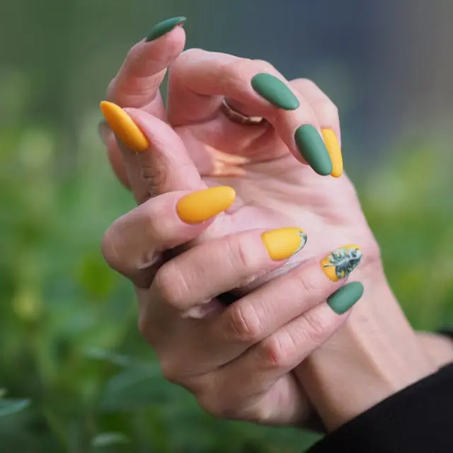 Bold yellow and green nails that bring fresh, tropical energy to your style.