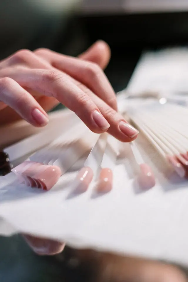 Flawless pink nails shown beside pristine press-ons — art meets precision.